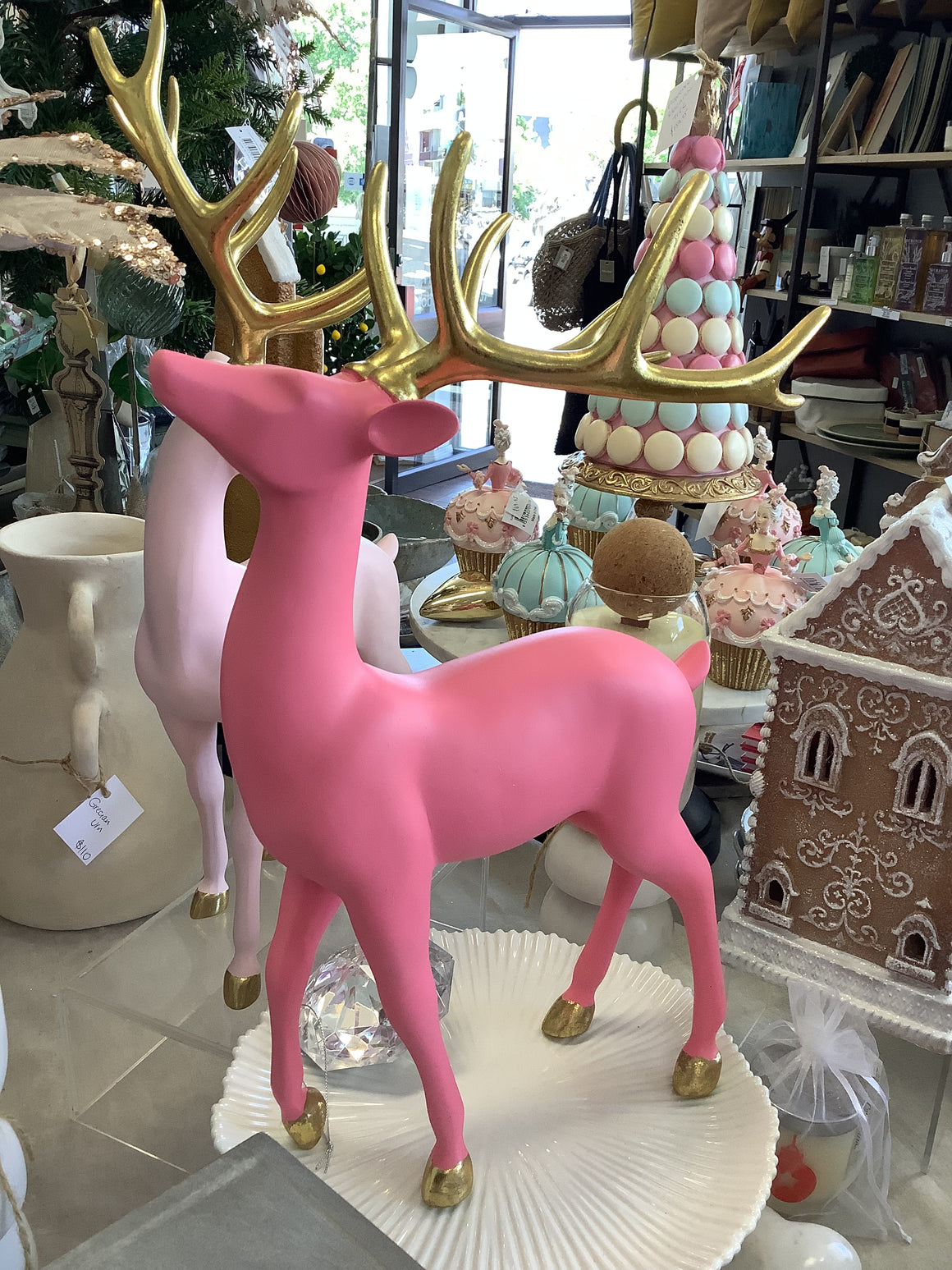 fuchsia pink and gold reindeer statue