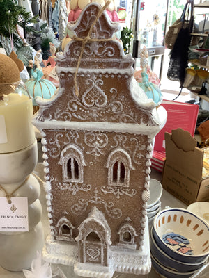 brown and white glitter ornate gingerbread house