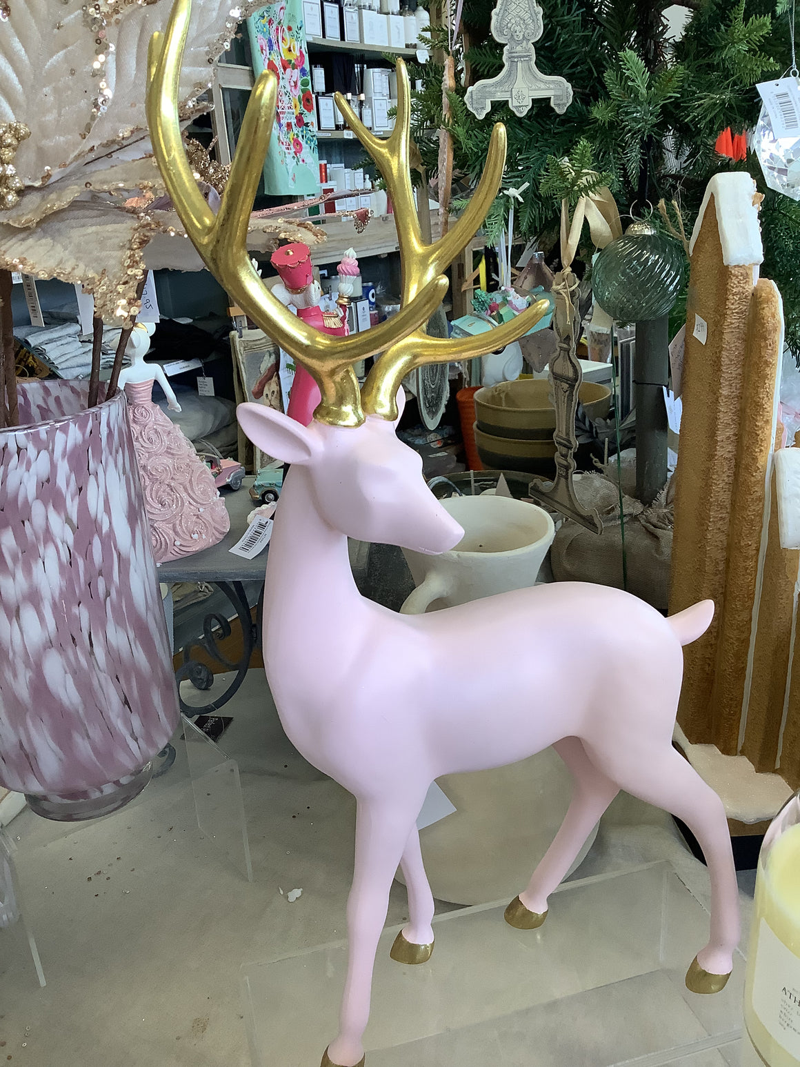 light pink and gold reindeer statue