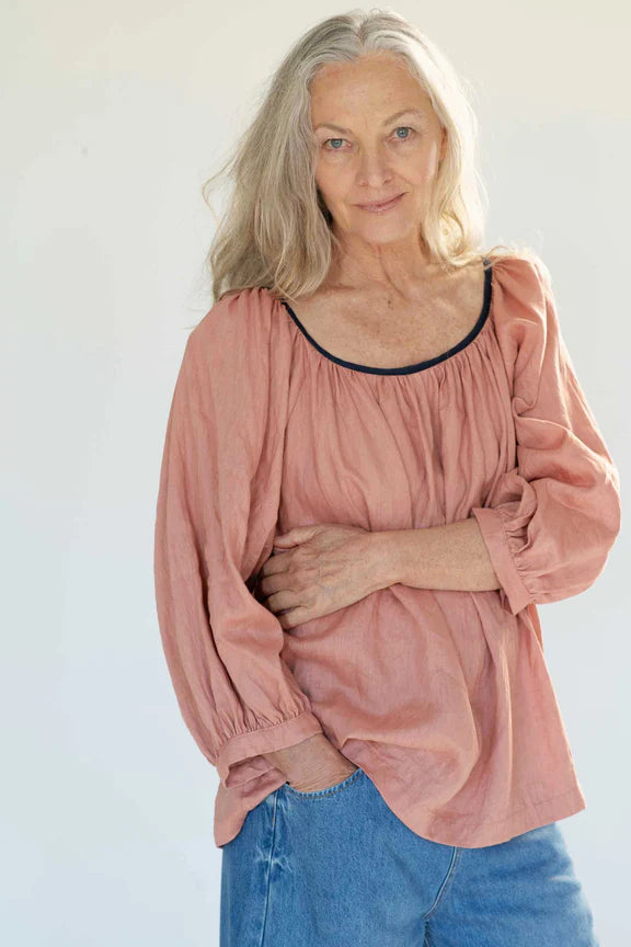 Long sleeve dusty pink linen top with loose fit and rounded neckline